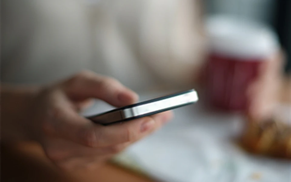 A person using a mobile phone.